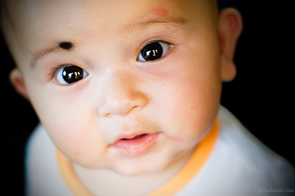 Portrait of the curious looking baby Pritha Thapa