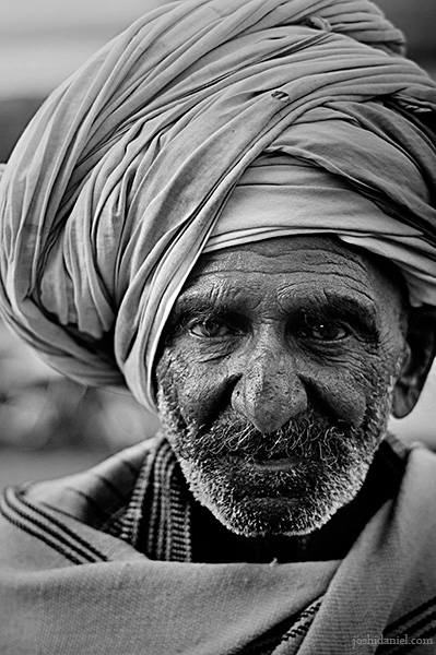 Black and white portrait of an old man in a turban from Rajasthan, India