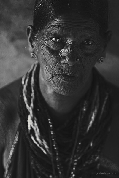 Black and white portrait of a Halakki tribe woman wearing traditional jewellery in Kumta, Karnataka