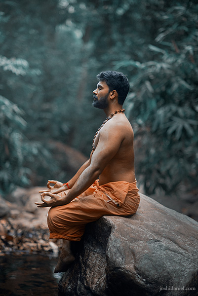 Vivek Gopan sitting and meditating in Kallar, Trivandrum