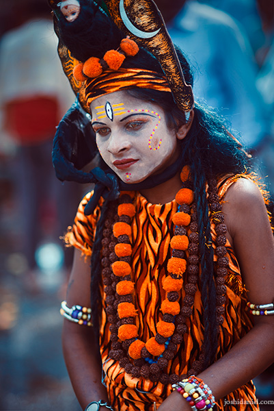 A young boy dressed as the Hindu deity Shiva at the Nashik Kumbh Mela