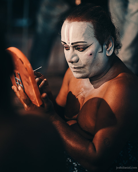Portrait of a Kattai koothu artist doing his make-up before a performance in Chennai, Tamil Nadu, India