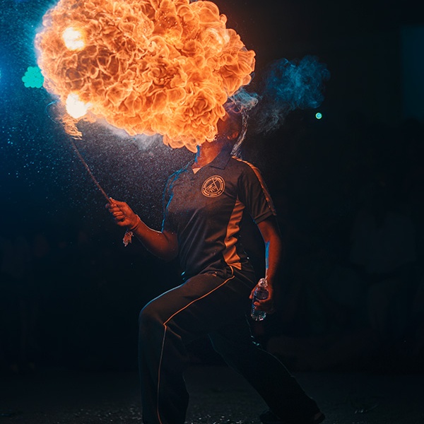 A girl performing a fire eating stunt during the Mylapore, Chennai, Tamil Nadu, India