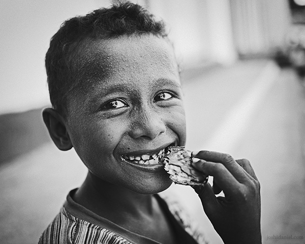 A 28mm wide angle black and white portrait of a young boy from Tual, Maluku, Indonesia