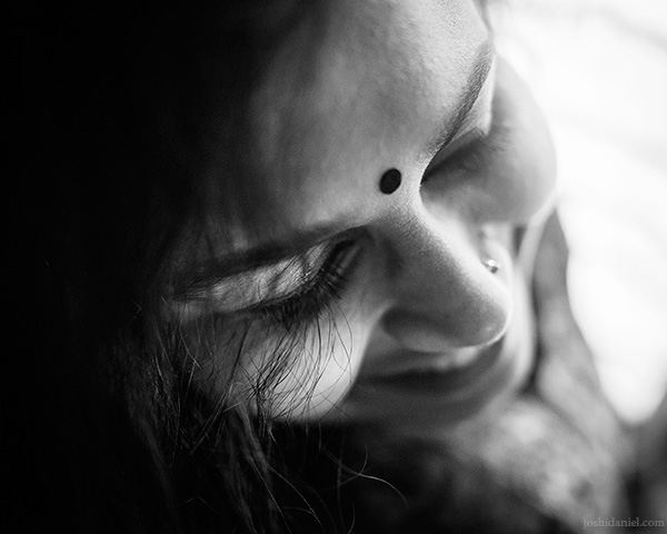 A 28mm wide angle black and white portrait of a shy Parvathy Krishnan in Bangalore, Karnataka, India