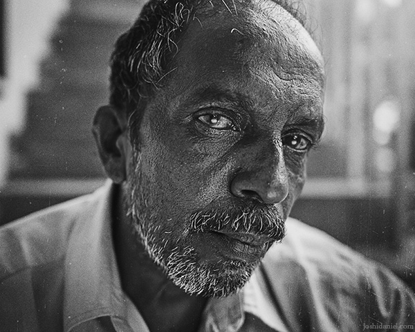 A 28mm wide angle black and white portrait Rajasekaran chettan from Trivandrum, Kerala, India