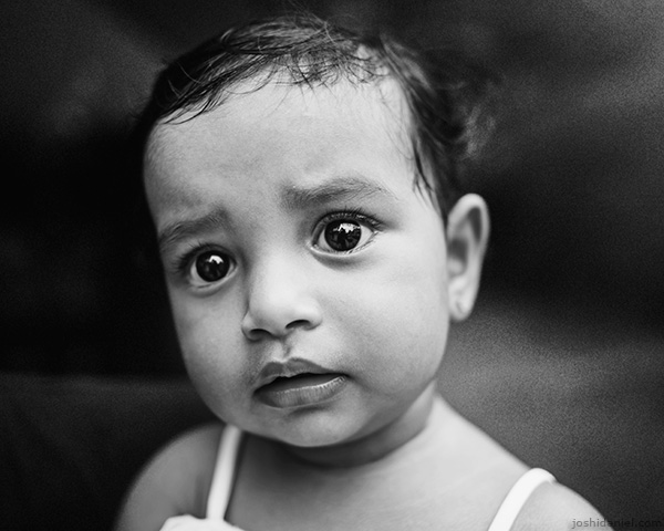A 28mm wide angle black and white portrait of a wondering little girl in Trivandrum, Kerala, India